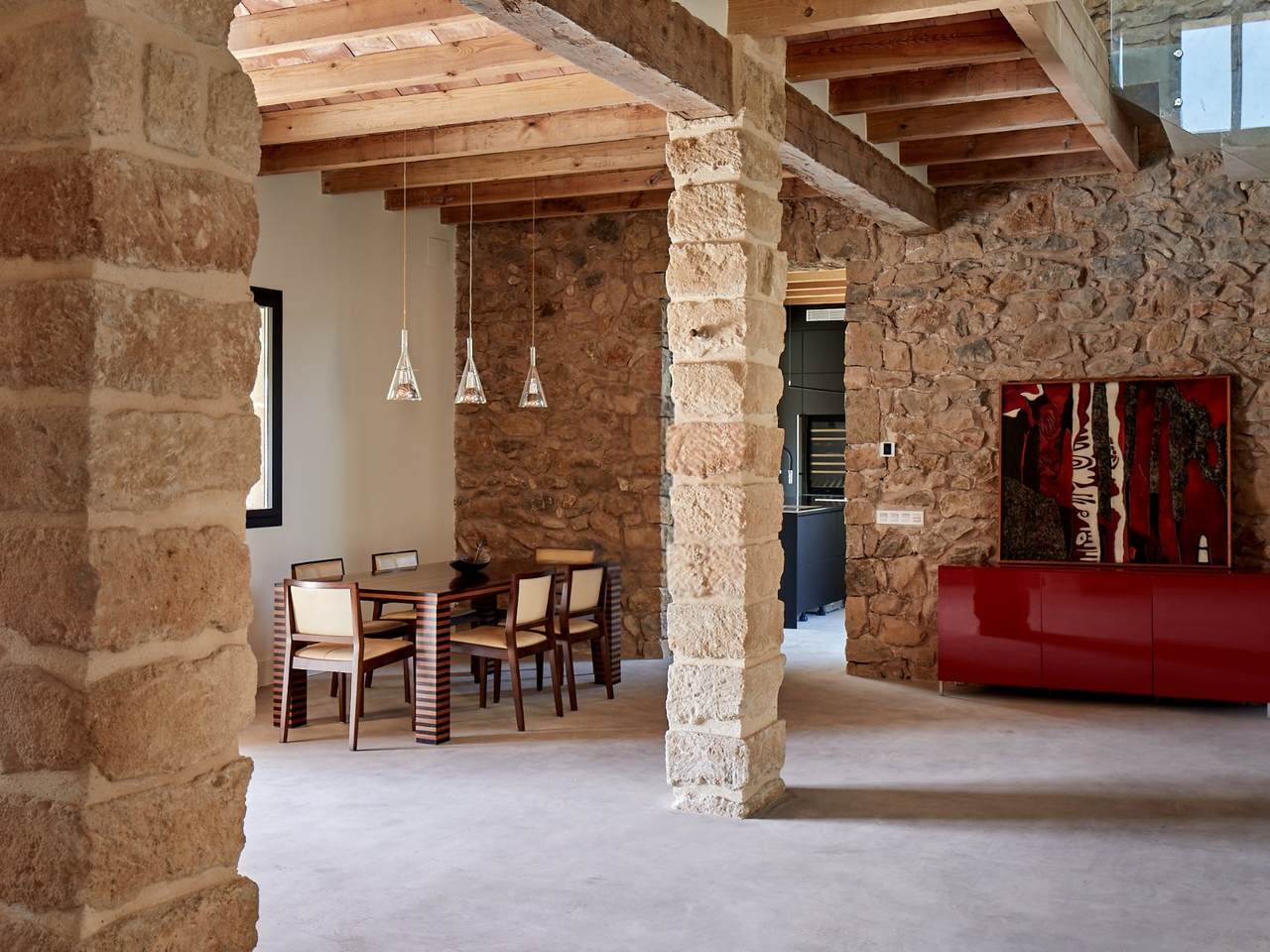 Restored stone finca interior with wooden beams at The Jungest Spain